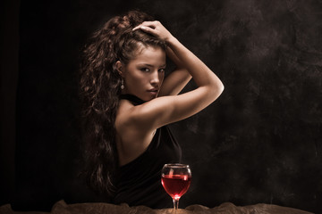 beautiful woman and glass of wine