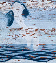 Graffiti Of Whale On Brick Wall With Waves
