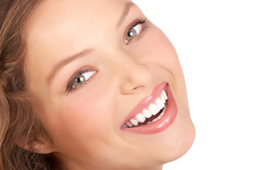 Wall Mural - Beautiful young woman smiling. Isolated over white  background.