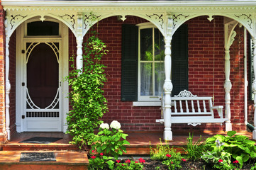 Wall Mural - Beautiful porch of victorian house decorated with flowers