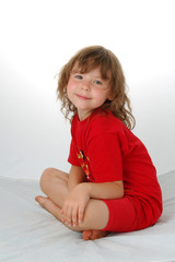 Portrait of little girl on red. Smile face