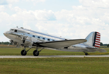 Poster - Vintage silver colored turboprop airplane side view