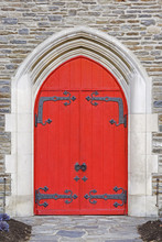 Red Church Doors On A Old Stone Church