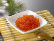 The fresh salmon roe on white plate