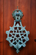 Pentacle knocker on a wooden door