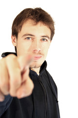 A young man indicating on white background