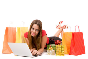 Beautiful shopping girl shopping over internet.