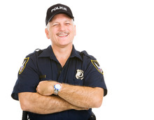Happy, Laughing Police Officer.  Isolated On White.