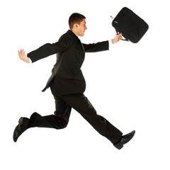 Wall Mural - jumping young manager in suit on white