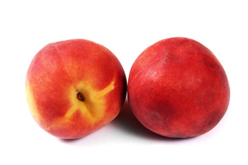 Fresh two peaches isolated on white background