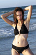 © Photo_Ma - Woman in black bikinis posing on the beach