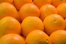 A Display Of Fresh Juicy Naval Oranges In A Fruit Market