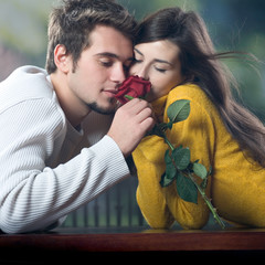 Wall Mural - young couple with rose, outdoors
