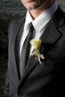 © Viktor Pravdica - Closeup photo of groom wearing boutonniere