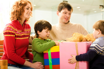 Poster - Happy parents looking at their children