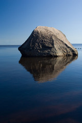 lonely stone in blue water