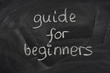 guide for beginners title on a blackboard