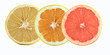 Slices of lemon, orange, and grapefruit isolated on white backgr
