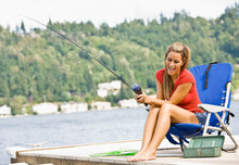 Woman Fishing On Pier