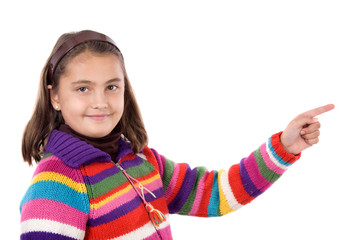 Wall Mural - Adorable girl with woollen jacket pointing