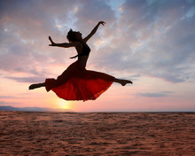 Jumping Woman At Sunset