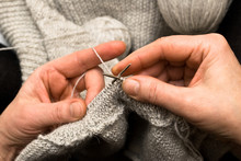 Two Hands Knitting A Wool Dress