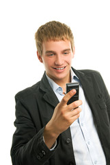 Wall Mural - Young happy man holding mobile phone