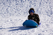 © Mehmet Dilsiz - Little Boy Sledding down the Hill