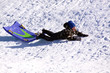 © Mehmet Dilsiz - Little Boy Sledding down the Hill