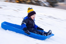 Little Boy's First Sled Ride