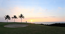 Golfers Silhouette At Sunset; Panorama
