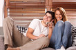 © Bocos Benedict - young couple watching tv