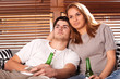 © Bocos Benedict - young couple watching tv and drinking beer