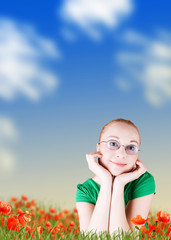 Wall Mural - happy woman lying on poppy flowers field