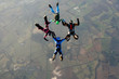 © Joggie Botma - Four skydivers in freefall