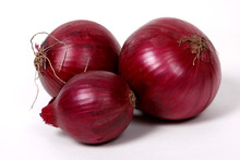 Red Onions On The White Background.