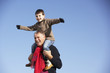 © Monkey Business - Grandfather Carrying Grandson On His Shoulders