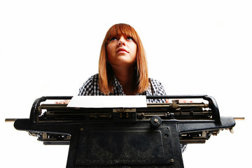 Business woman portrait in office with vintage typing machine