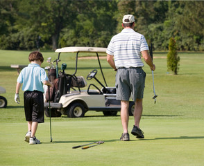 Father and Son Playing Golf