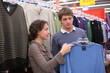 © Pavel Losevsky - Pair chooses sweater in shop
