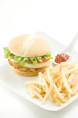 Wall Mural - crisp chicken burger with tomato onion cheese lettuce