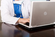 doctor using laptop computer doing work