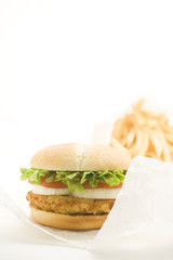 Wall Mural - crisp chicken burger with tomato onion cheese lettuce