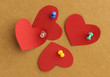 Paper's hearts with  thumbtacks