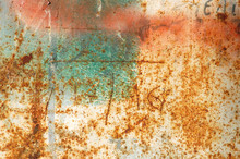 Rusty Metal Surface With Peeled Paint And Etched Numbers.