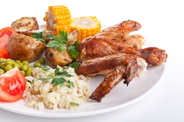 roasted chicken wings with potatoes, tomatoes, corn and rice