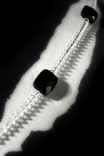 Necklaces Over Black White Zebra Background