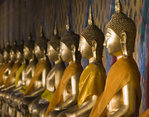 Wall Mural - Row of Buddhas at Wat Arun in Bangkok, Thailand.