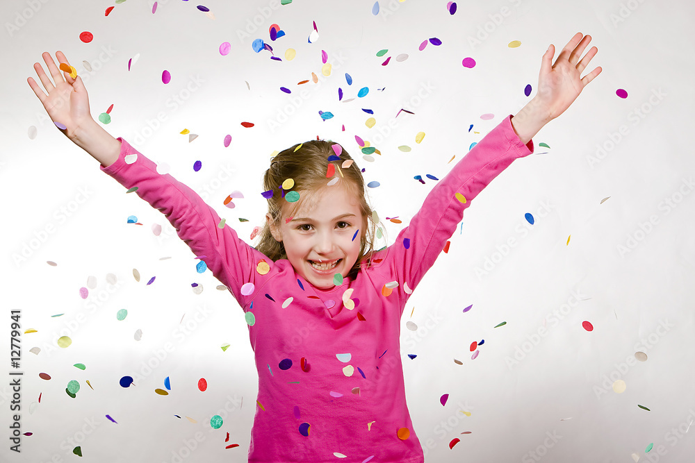 Young girl throwing confetti in the air Stock Photo Adobe Stock