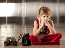 Sullen Young Girl In Red